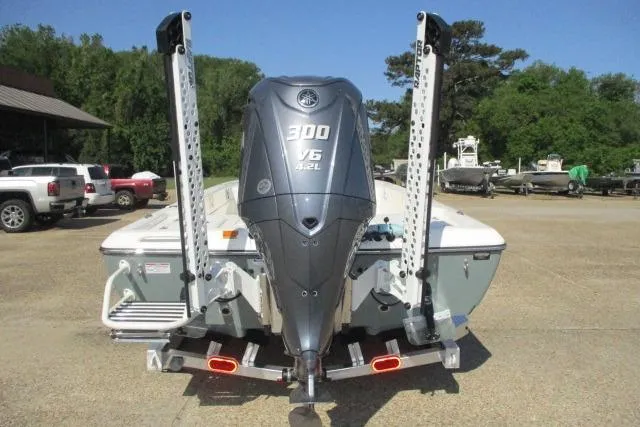 Slide: The Image of 2025 Skeeter SX241 boat with Yamaha 300 V6 engine, parked outdoors. - 10