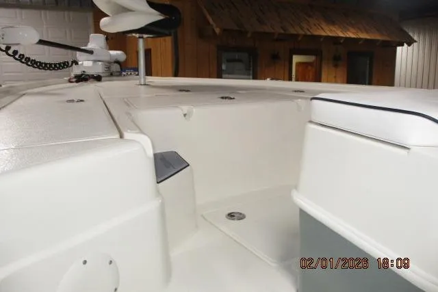 Slide: The Image of 2025 Skeeter SX241 boat interior with white deck and storage compartments. - 4