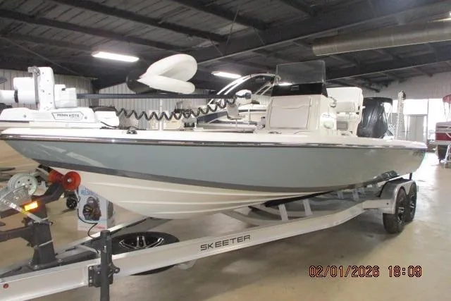 Slide: The Image of 2025 Skeeter SX241 boat on trailer in indoor storage facility. - 7
