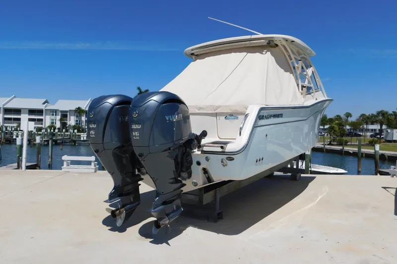 Slide: The Image of 2015 Grady-White Freedom 307 boat with twin Yamaha V6 engines docked. - 3