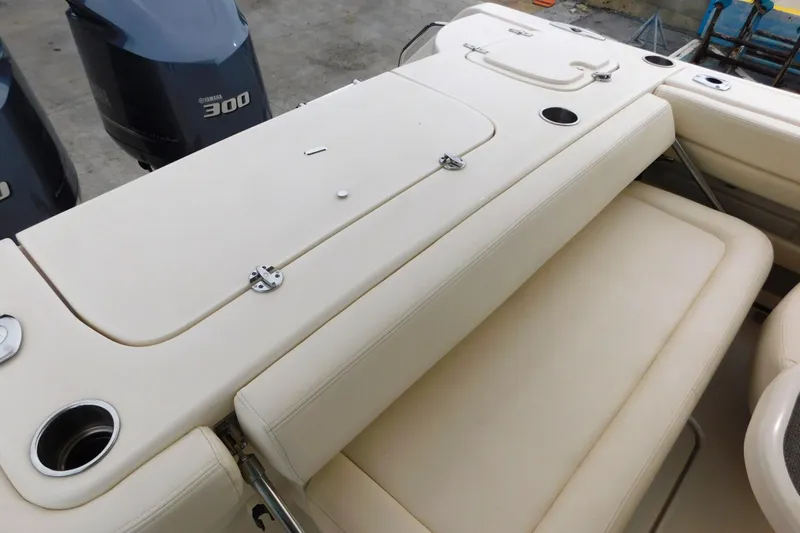 Slide: The Image of 2015 Grady-White Freedom 307 boat interior with seating and Yamaha 300 engines. - 14