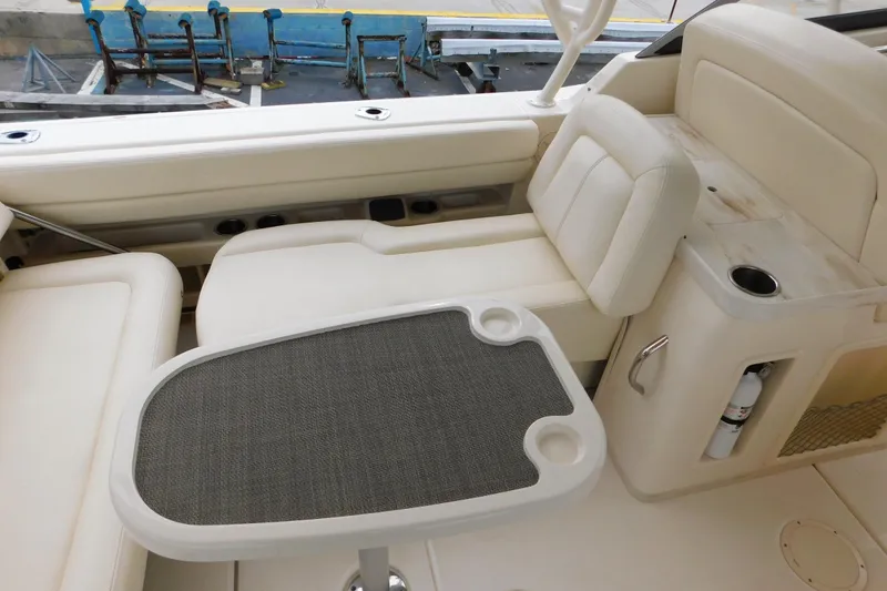 Slide: The Image of Interior of 2015 Grady-White Freedom 307 boat with seating and table. - 17