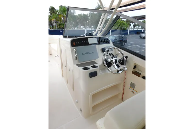 Slide: The Image of 2015 Grady-White Freedom 307 boat helm with Garmin navigation system. - 19