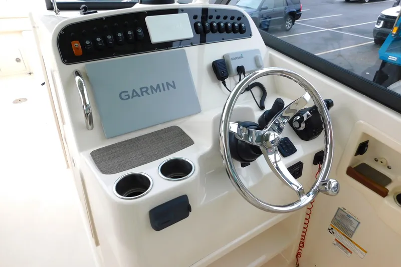 Slide: The Image of Control panel of a 2015 Grady-White Freedom 307 boat with Garmin navigation system. - 21