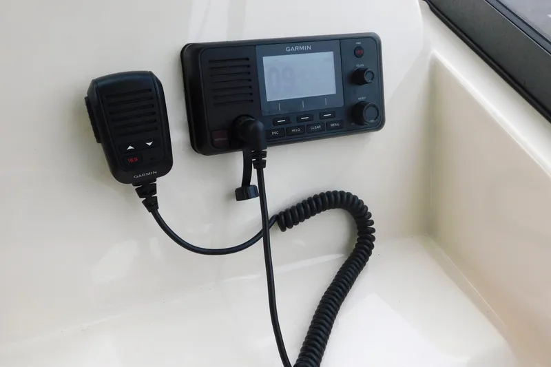Slide: The Image of Garmin marine radio system on 2016 Grady-White Freedom 307 boat dashboard. - 24