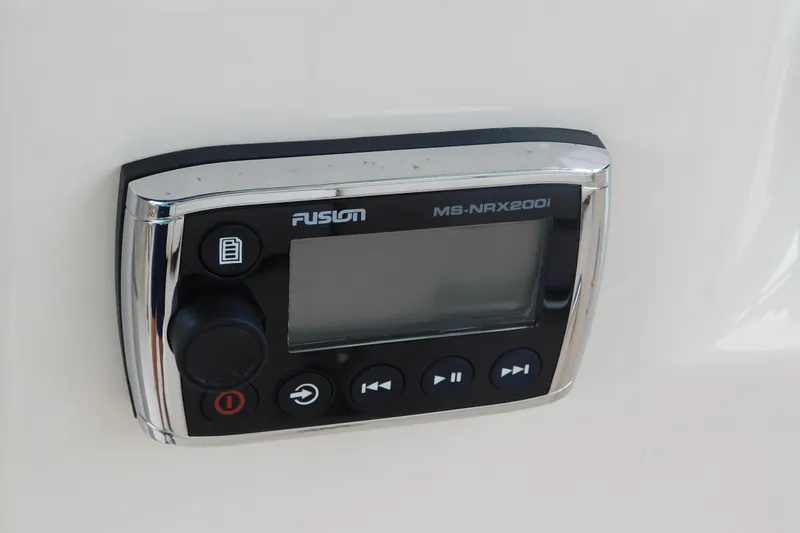 Slide: The Image of Fusion MS-NRX200i marine stereo control on 2015 Grady-White Freedom 307 boat. - 27