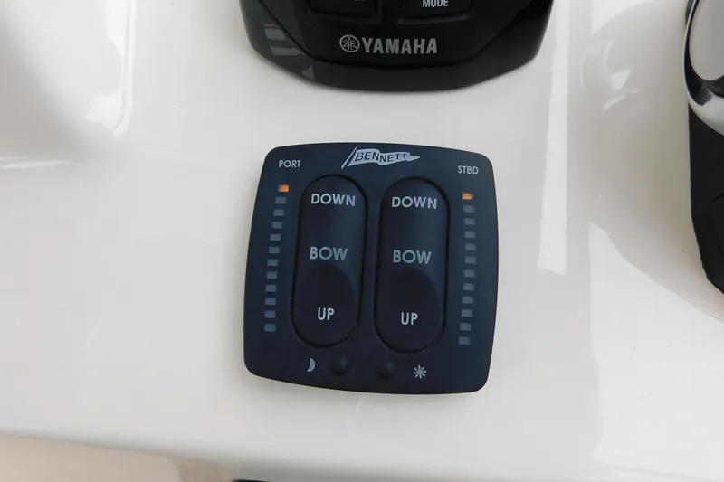 Slide: The Image of Bennett trim tab control panel on 2015 Grady-White Freedom 307 boat. - 28