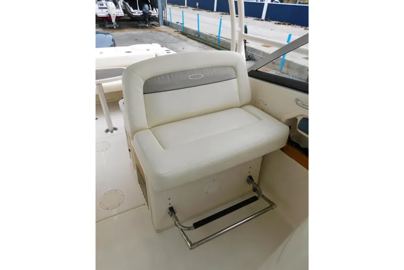Slide: The Image of 2015 Grady-White Freedom 307 boat interior with white cushioned seating. - 31