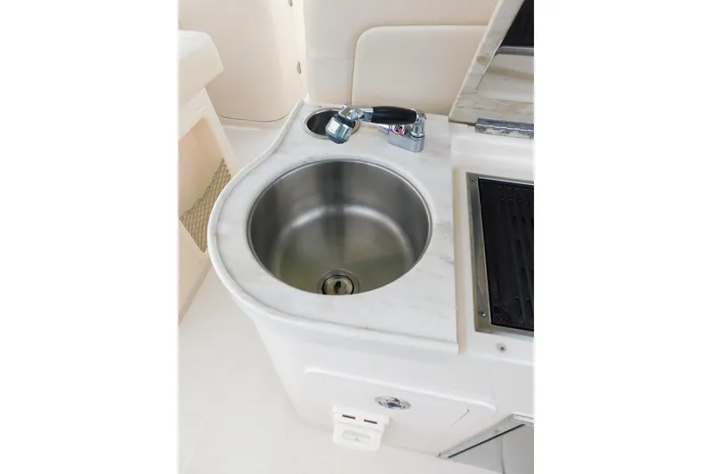 Slide: The Image of 2015 Grady-White Freedom 307 boat sink and countertop detail. - 36