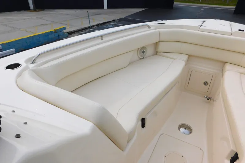Slide: The Image of 2016 Grady-White Freedom 307 boat interior with white cushioned seating. - 47