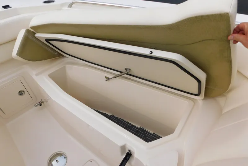 Slide: The Image of 2016 Grady-White Freedom 307 boat storage compartment with open cushioned seat. - 49