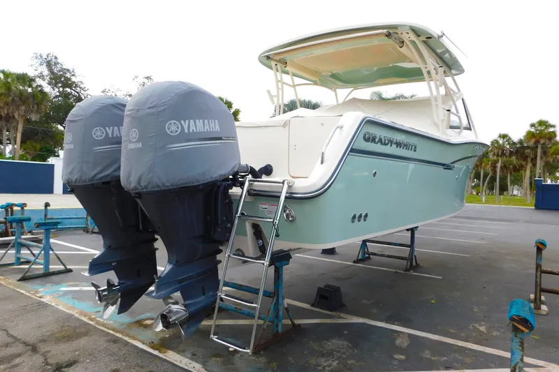Slide: The Image of 2015 Grady-White Freedom 307 boat with twin Yamaha engines on a trailer. - 5