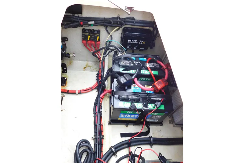 Slide: The Image of Electrical system of a 2015 Grady-White Freedom 307 boat, featuring batteries and wiring. - 53