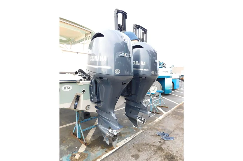 Slide: The Image of Twin Yamaha 300 outboard engines on a 2015 Grady-White Freedom 307 boat. - 6