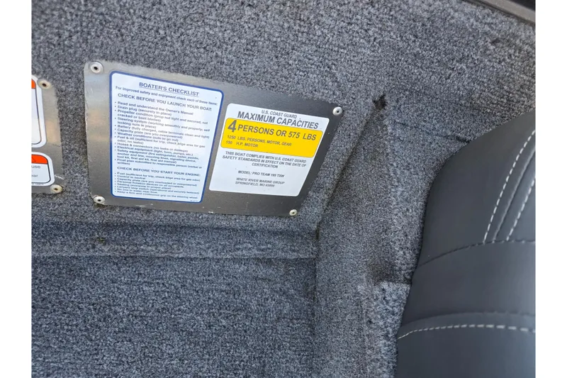 Slide: The Image of 2024 Tracker Pro Team 195 TXW boat capacity and safety checklist labels. - 13