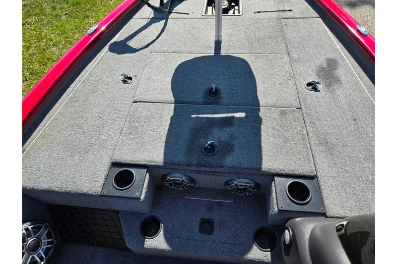 Slide: The Image of 2024 Tracker Pro Team 195 TXW Tournament Edition boat deck with carpet and cup holders. - 14