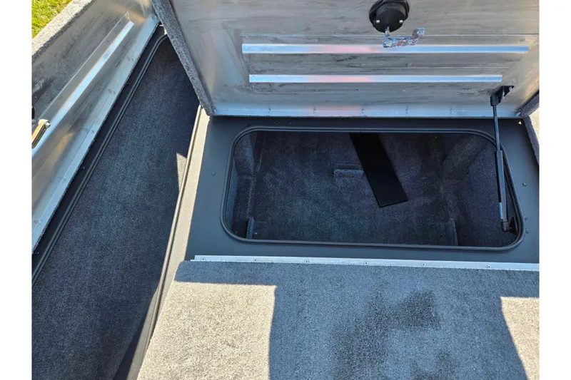Slide: The Image of Open storage compartment in 2024 Tracker Pro Team 195 TXW Tournament Edition boat. - 15