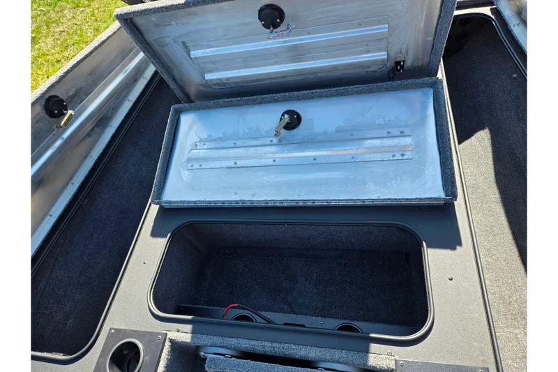 Slide: The Image of 2024 Tracker Pro Team 195 TXW Tournament Edition boat storage compartments open. - 16