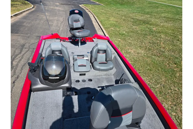 Slide: The Image of 2024 Tracker Pro Team 195 TXW Tournament Edition boat with gray seating and red accents. - 18