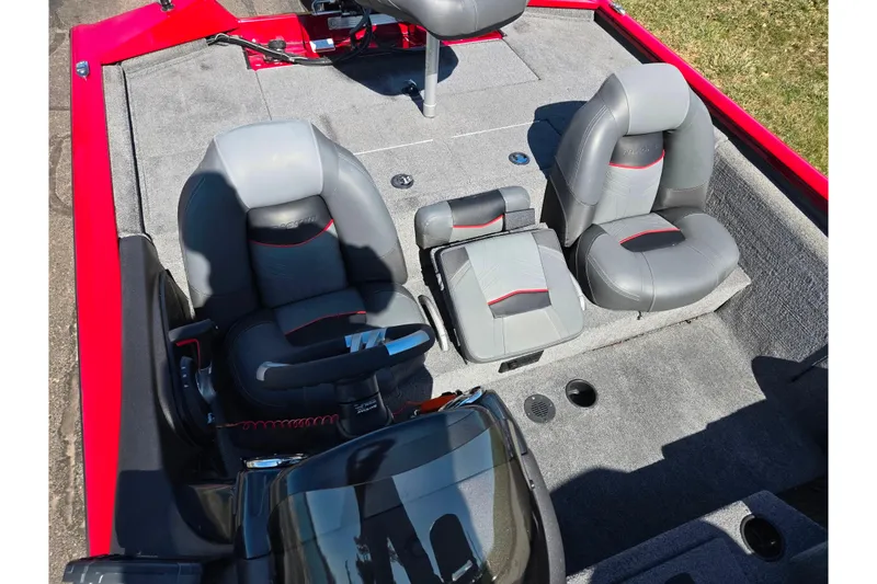 Slide: The Image of 2024 Tracker Pro Team 195 TXW Tournament Edition boat interior with gray and red seating. - 19