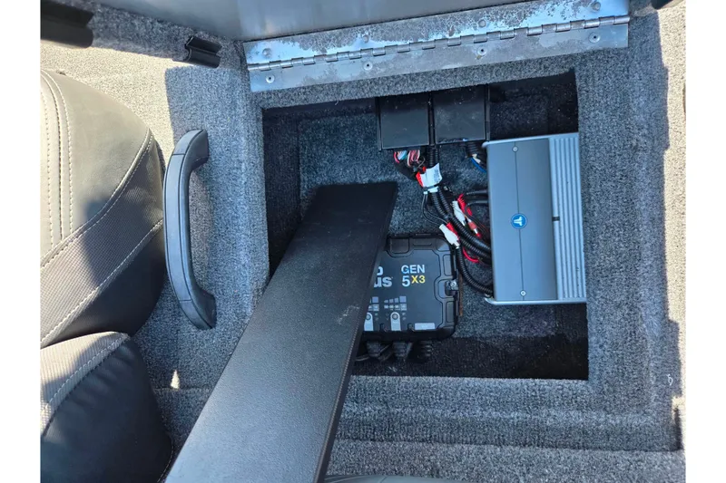 Slide: The Image of 2024 Tracker Pro Team 195 TXW Tournament Edition boat battery compartment with wiring. - 20