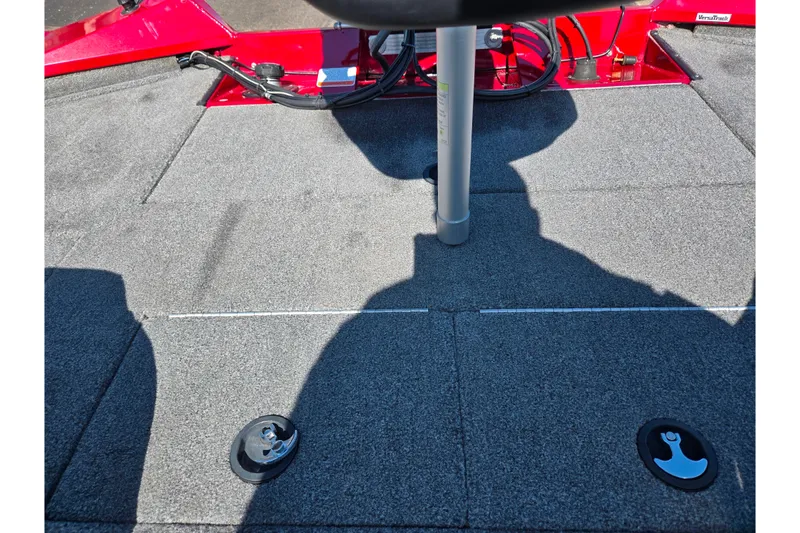 Slide: The Image of 2024 Tracker Pro Team 195 TXW Tournament Edition boat deck with red accents and storage compartments. - 21