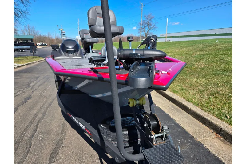 Slide: The Image of 2024 Tracker Pro Team 195 TXW Tournament Edition boat on pavement, showcasing front design. - 6