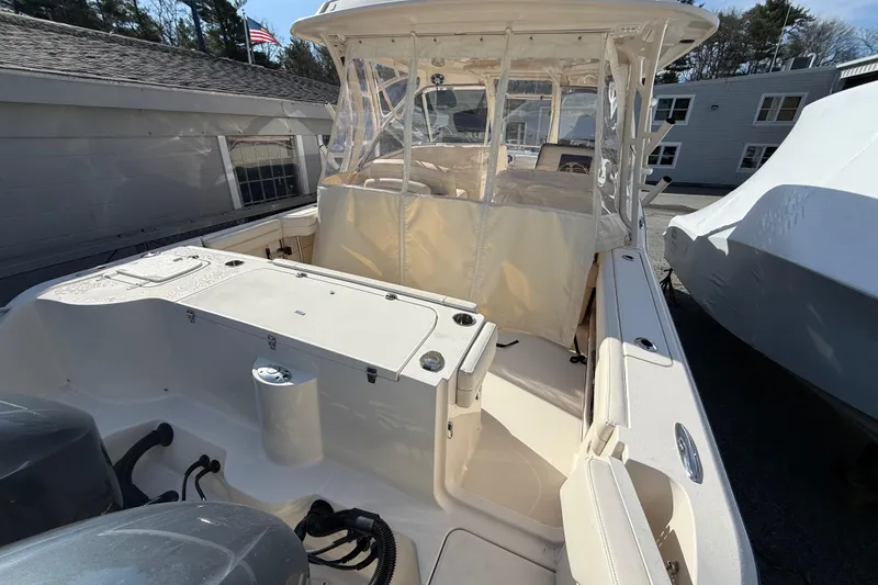 Slide: The Image of 2020 Grady-White Freedom 325 boat interior with seating and covered helm. - 12