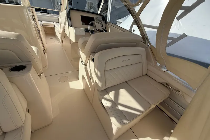 Slide: The Image of 2020 Grady-White Freedom 325 boat interior with luxurious seating and modern helm. - 14