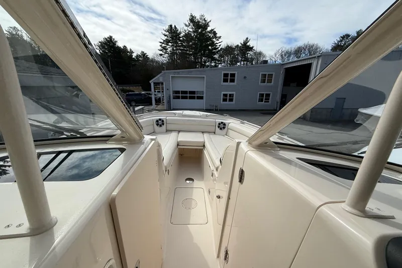 Slide: The Image of 2020 Grady-White Freedom 325 boat interior with spacious seating and clear canopy. - 21