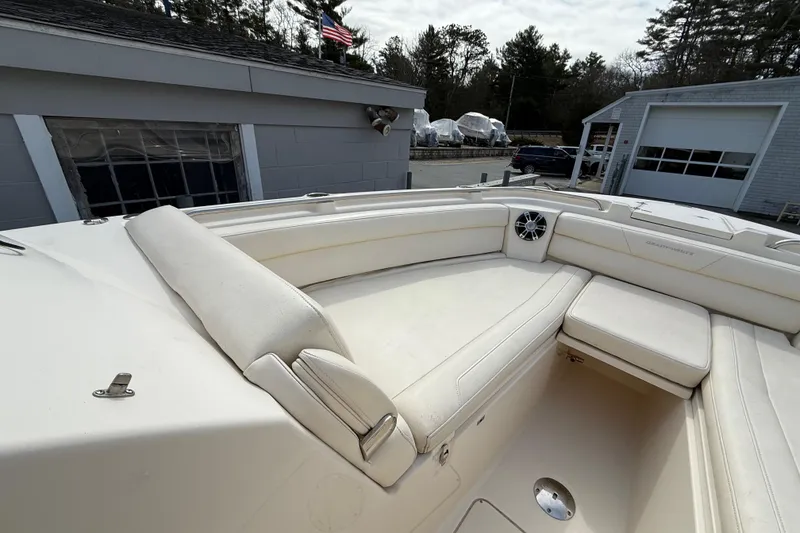 Slide: The Image of 2020 Grady-White Freedom 325 boat with beige seating area. - 23