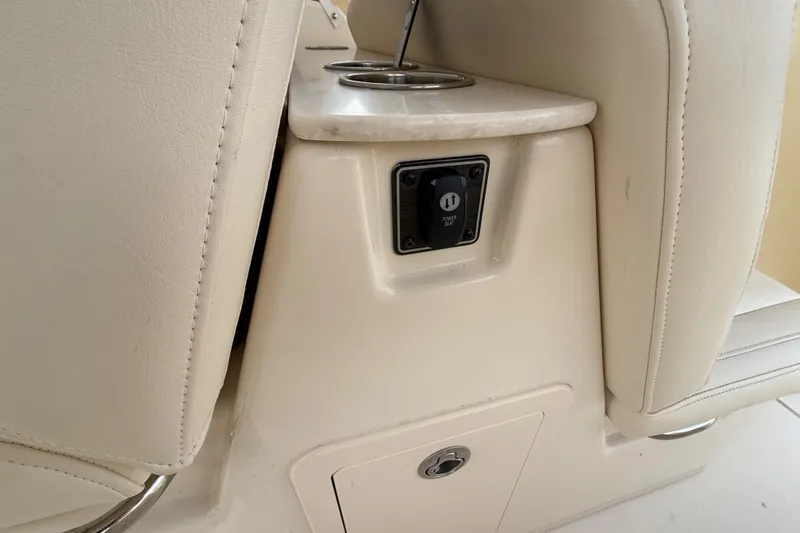 Slide: The Image of 2020 Grady-White Freedom 325 boat interior with cup holders and power outlet. - 28