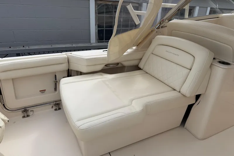 Slide: The Image of 2020 Grady-White Freedom 325 boat interior with luxurious white seating. - 29
