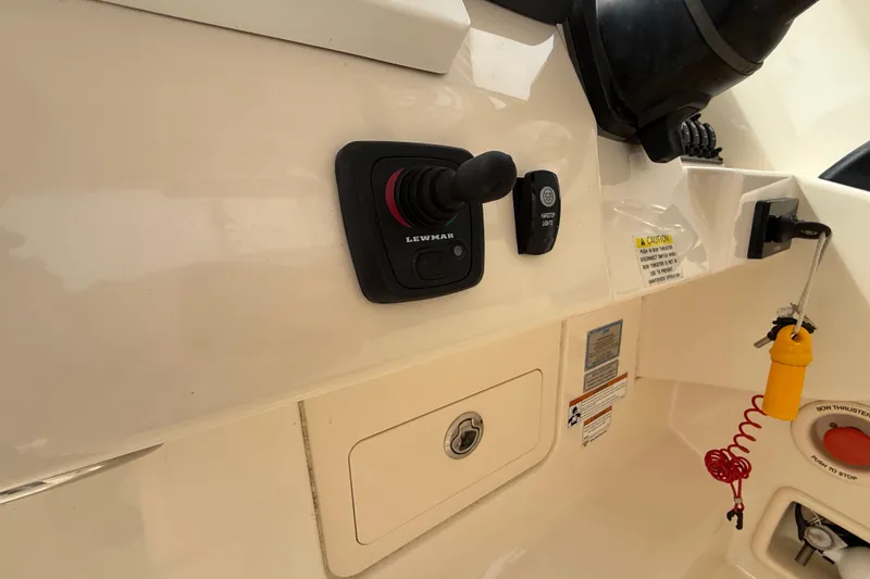 Slide: The Image of Control panel of a 2020 Grady-White Freedom 325 boat with joystick and safety features. - 31
