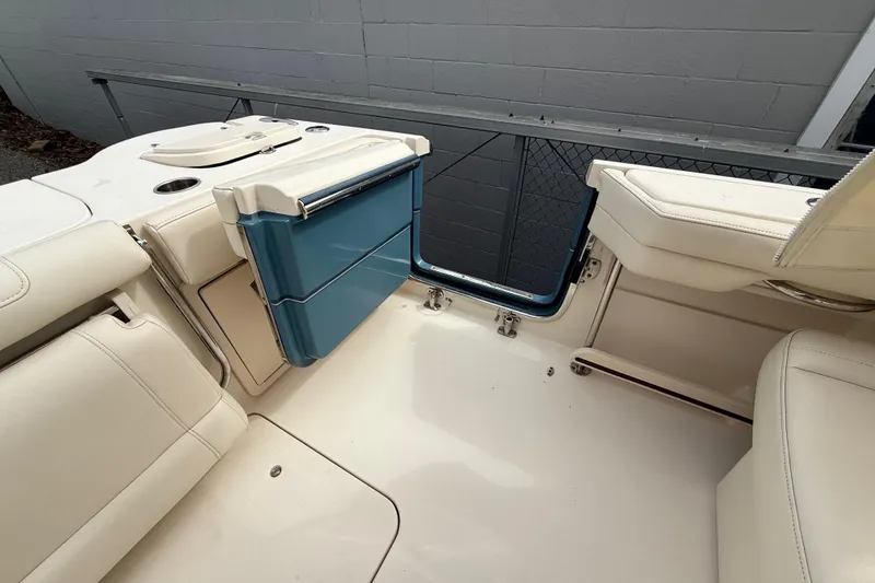 Slide: The Image of 2020 Grady-White Freedom 325 boat interior with seating and storage compartments. - 33