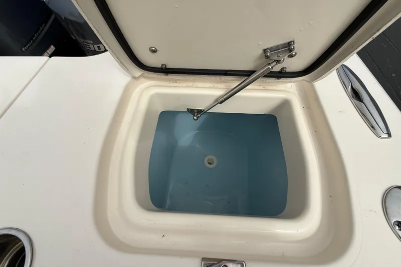 Slide: The Image of Open storage compartment on 2020 Grady-White Freedom 325 boat, showcasing interior details. - 34