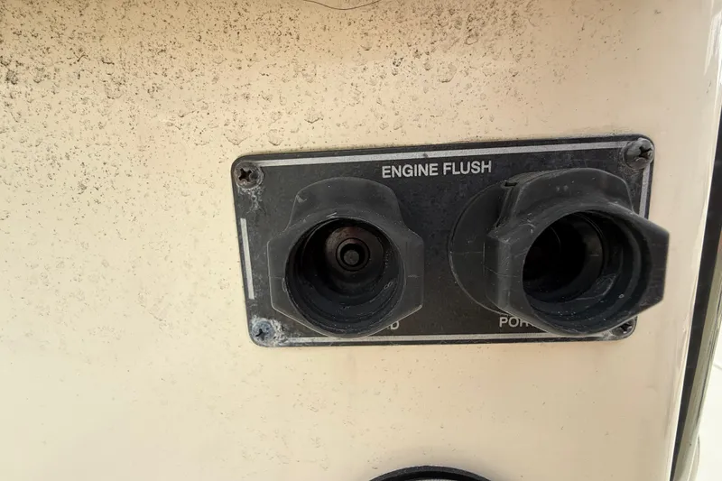 Slide: The Image of Engine flush ports on a 2020 Grady-White Freedom 325 boat. - 39