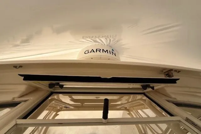 Slide: The Image of 2020 Grady-White Freedom 325 boat with Garmin radar under protective cover. - 4