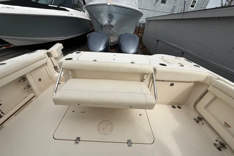 Slide: The Image of 2020 Grady-White Freedom 325 boat interior with seating and storage compartments. - 40