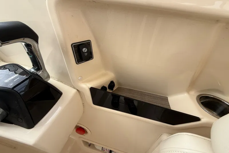 Slide: The Image of Interior view of a 2020 Grady-White Freedom 325 boat cockpit controls. - 46
