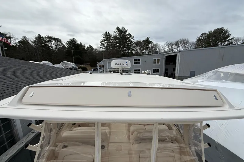 Slide: The Image of 2020 Grady-White Freedom 325 boat with Garmin equipment, docked near a building. - 48