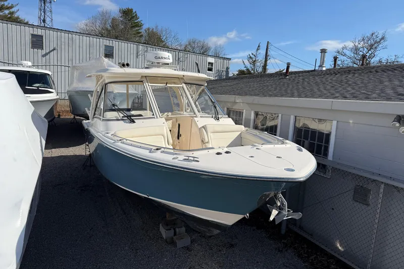 The Image of 2020 Grady-White Freedom 325 boat on display outdoors, featuring a sleek design. - 5