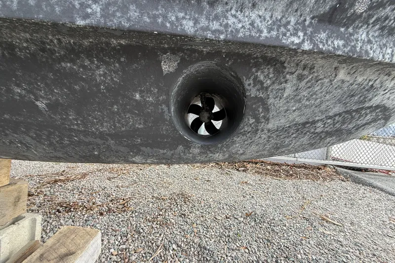 Slide: The Image of Bottom view of a 2020 Grady-White Freedom 325 boat hull with a bow thruster. - 51