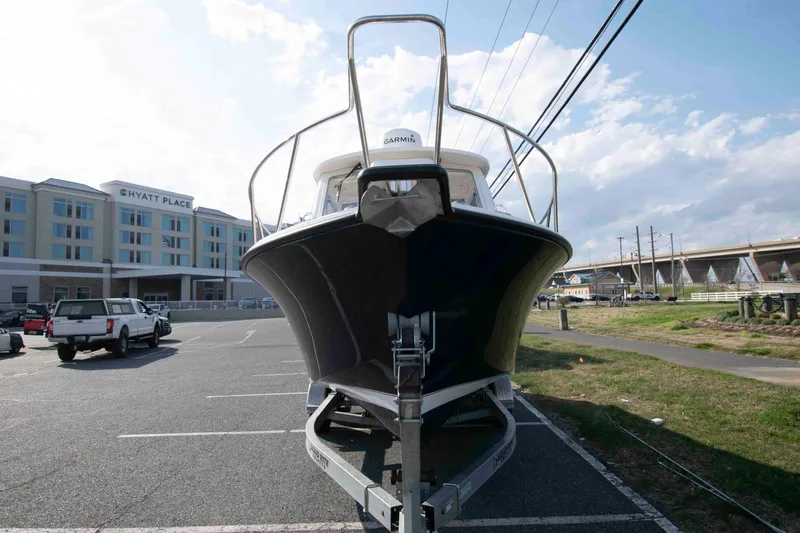 Slide: The Image of 2020 NorthCoast 235 HT boat on trailer in parking lot near Hyatt Place hotel. - 3