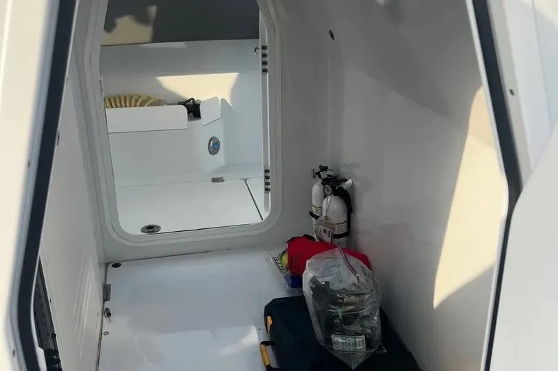 Slide: The Image of Interior of a 2022 Freeman 37VH boat, featuring storage and safety equipment. - 10