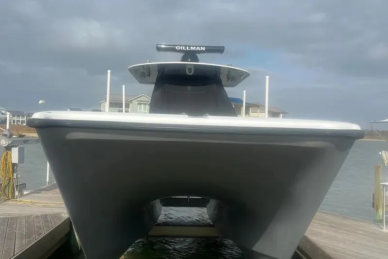 Slide: The Image of Front view of a 2022 Freeman 37VH boat docked by the water. - 11