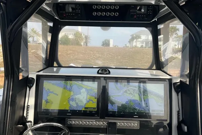 Slide: The Image of Interior view of 2022 Freeman 37VH boat cockpit with dual navigation screens. - 4