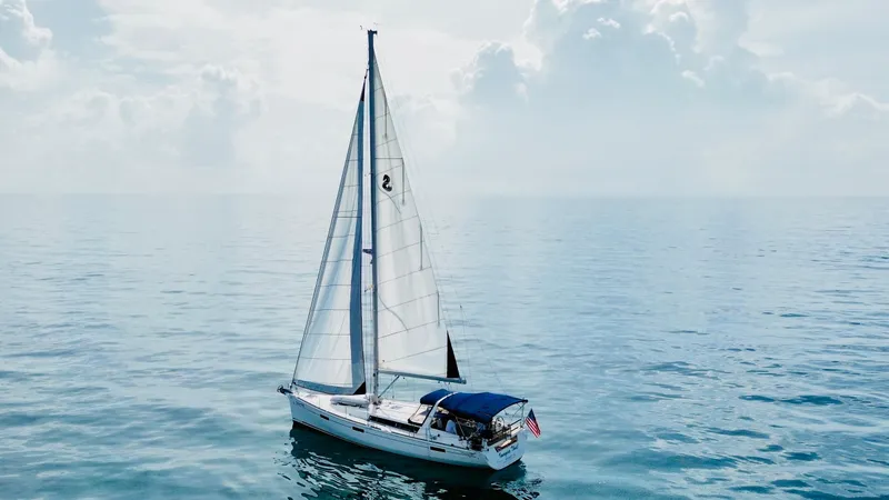 Slide: The Image of Sailing yacht Beneteau Oceanis 45, 2015 model, on calm ocean waters under cloudy sky. - 10