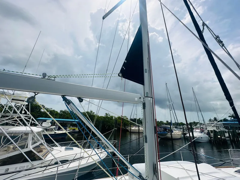 Slide: The Image of Beneteau Oceanis 45 sailboat docked at marina, cloudy sky, 2015 model. - 35