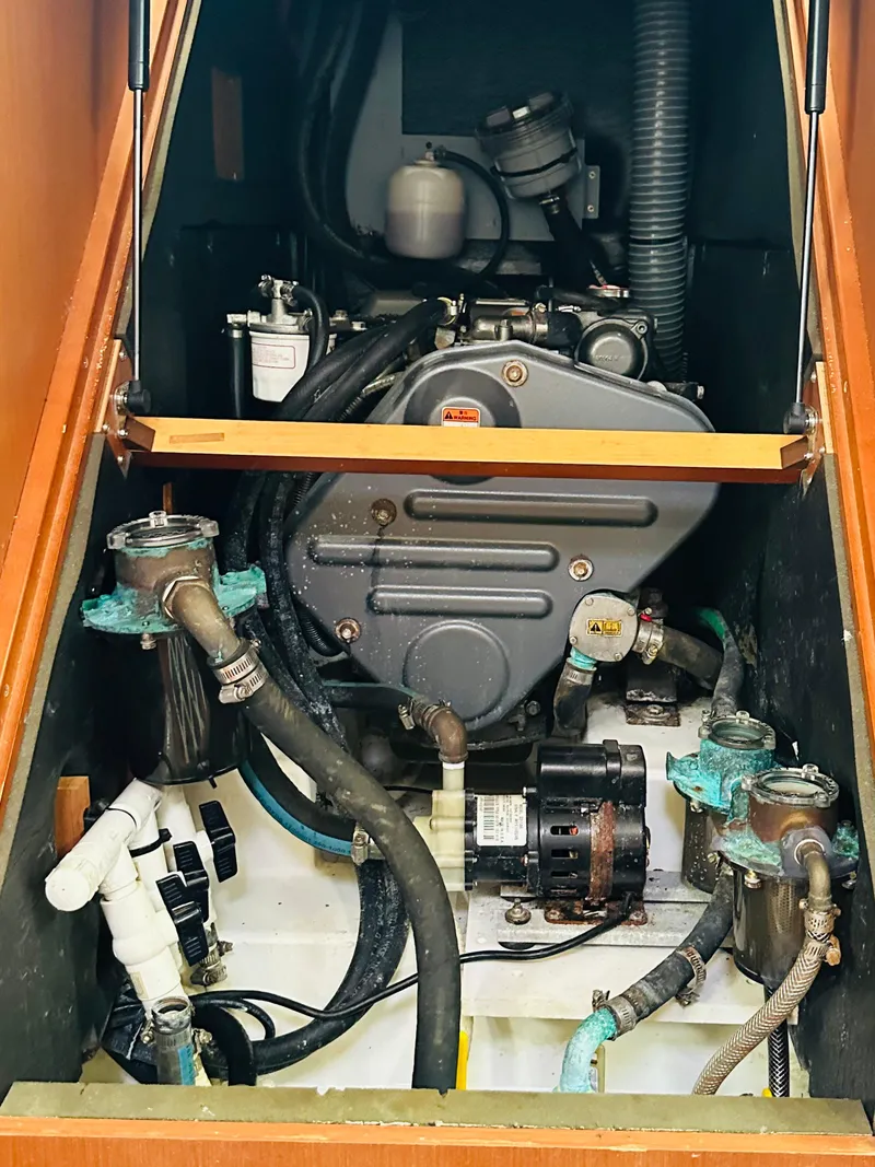 Slide: The Image of Engine compartment of a 2015 Beneteau Oceanis 45 sailboat, showcasing mechanical components. - 45